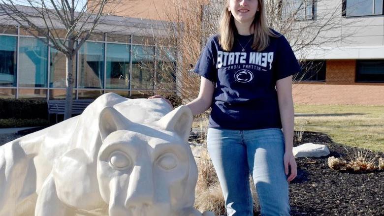 Taylor Charles next to the Nittany Lion shrine on the campus of Penn State DuBois